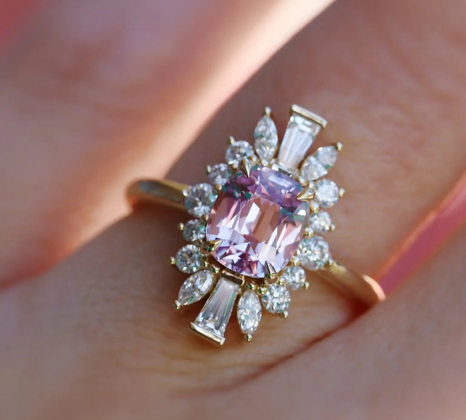 Close up of 2.34ct Pink Spinel Ballerina Ring on hand