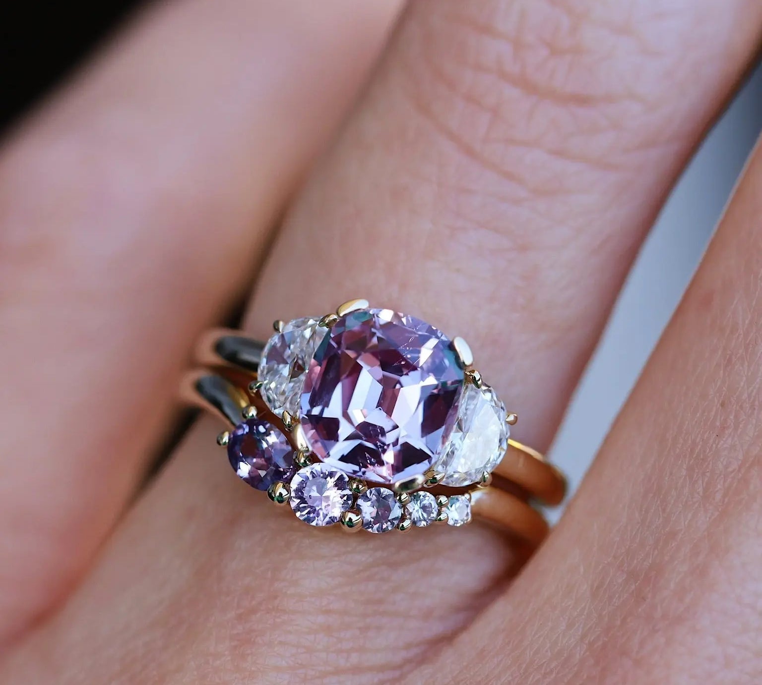 Close up of 2.62ct Sapphire and Diamond Ring with Tracer Band on hand