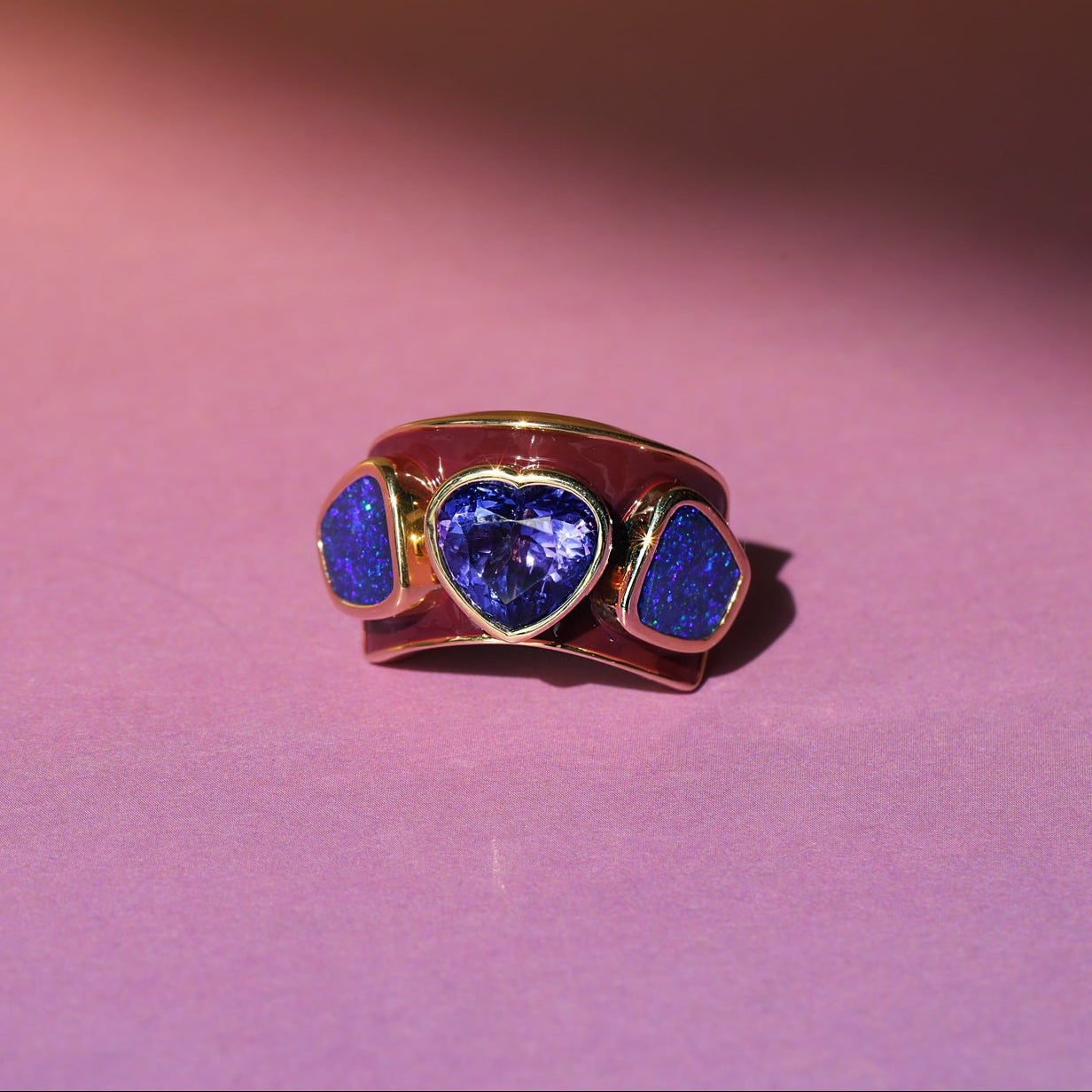 Berry enamel ring in 14k yellow gold set with a tanzanite heart and two freeform boulder opals