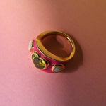 Hot pink enamel ring in 14k yellow gold set with a peridot heart and two opal hearts