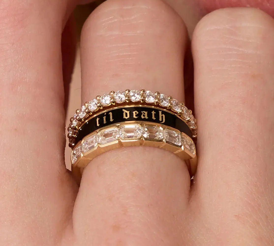 Close up of woman's fingers spotlighting a Marrow Fine ring stack - the Til Death Black Enamel Band 4mm in the middle