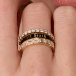 Close up of woman's fingers spotlighting a Marrow Fine ring stack - the Til Death Black Enamel Band 4mm in the middle