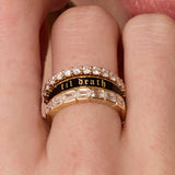 Close up of woman's fingers spotlighting a Marrow Fine ring stack - the Til Death Black Enamel Band 4mm in the middle