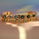 Flat lay of 6.67tcw Tourmaline Everyday Cuff stacked with Sapphire Cuff