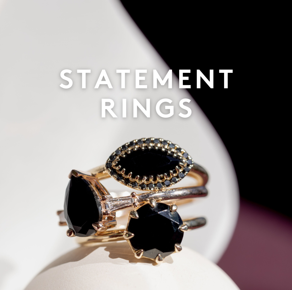 3 black gemstone Marrow rings stacked on top of each other