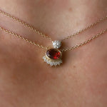Red-orange gemstone sunrise choker necklace on model, close up