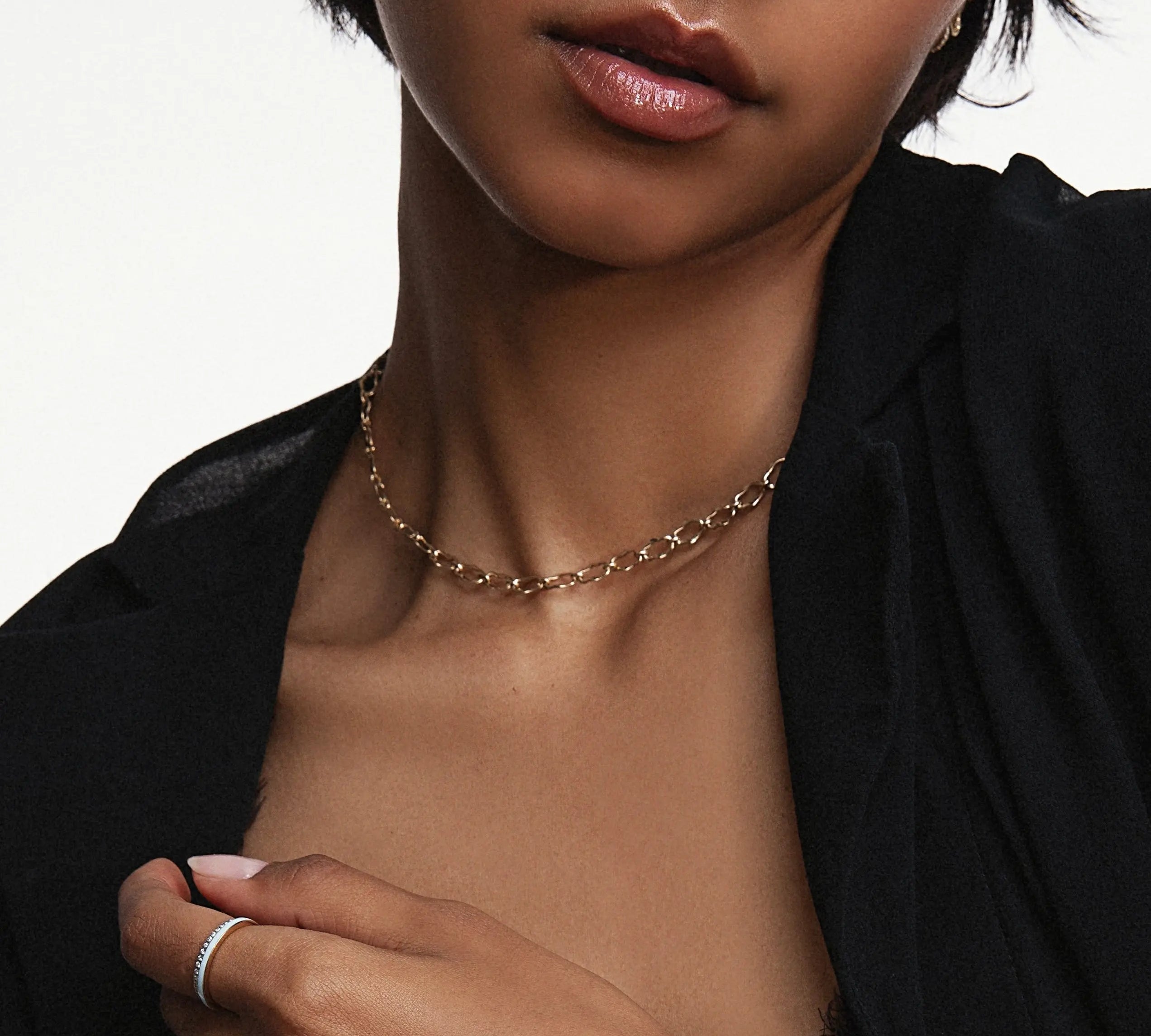 Close up of woman's decolletage wearing the 8mm Chain Necklace