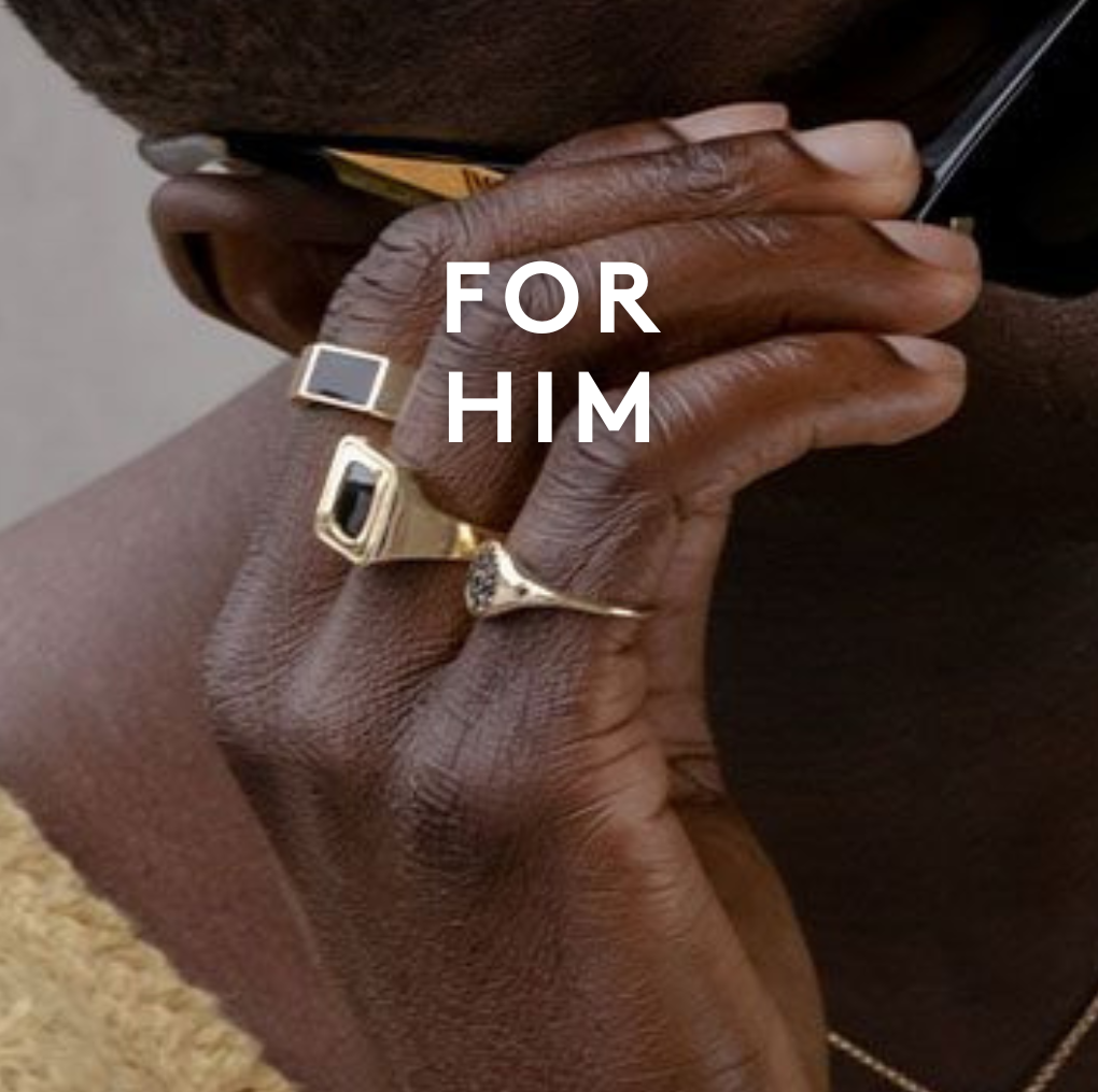 close up of man grabbing side of sunglasses with rings