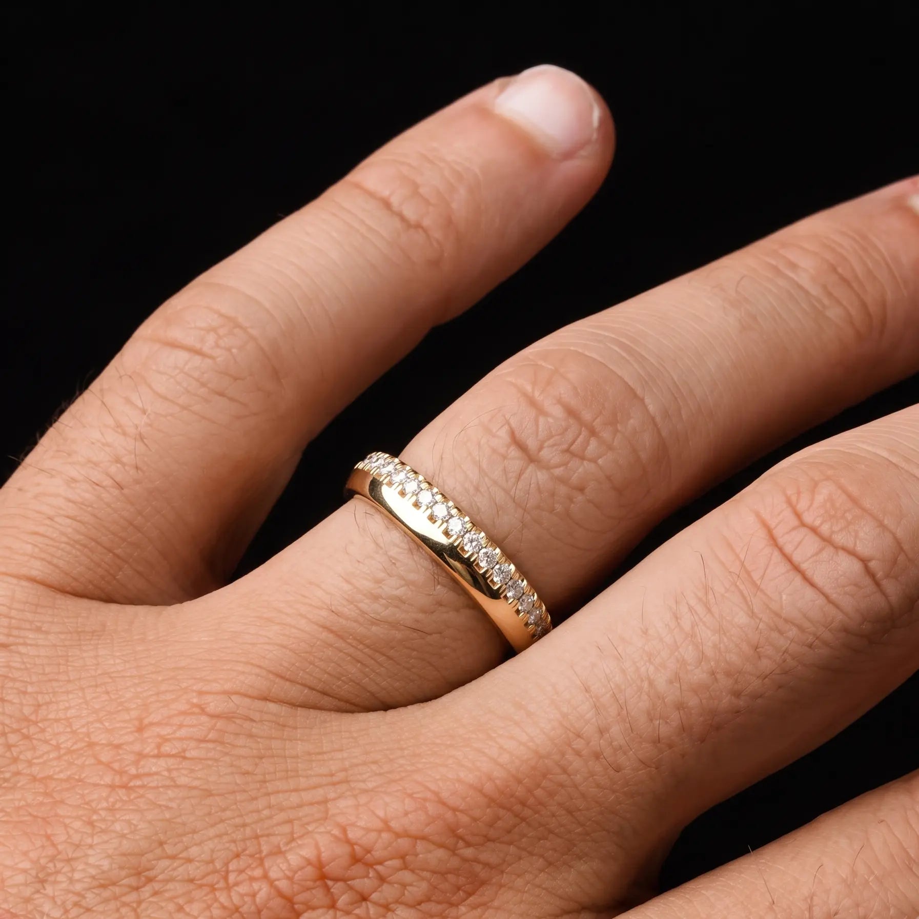Melinda white diamond band on a man's hand