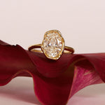 Abstract Bezel Diamond ring flat lay, on a pink flower