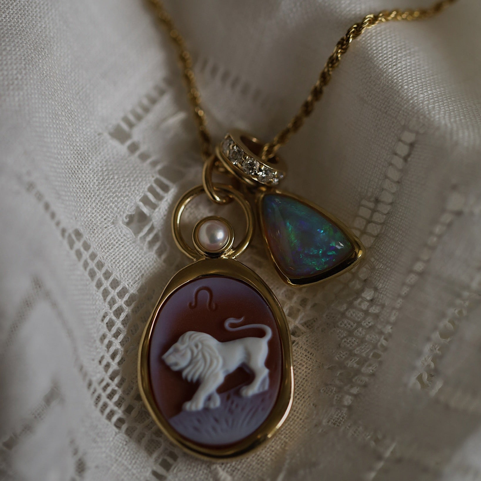Leo Zodiac orange agate carving pendant layered with a Birthstone Rondelle and an opal charm on gold chains
