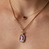 Aquarius Zodiac Orange Agate Carving with Diamond pendant, a hand-carved orange agate in 14k yellow gold with a round diamond, by Marrow Fine