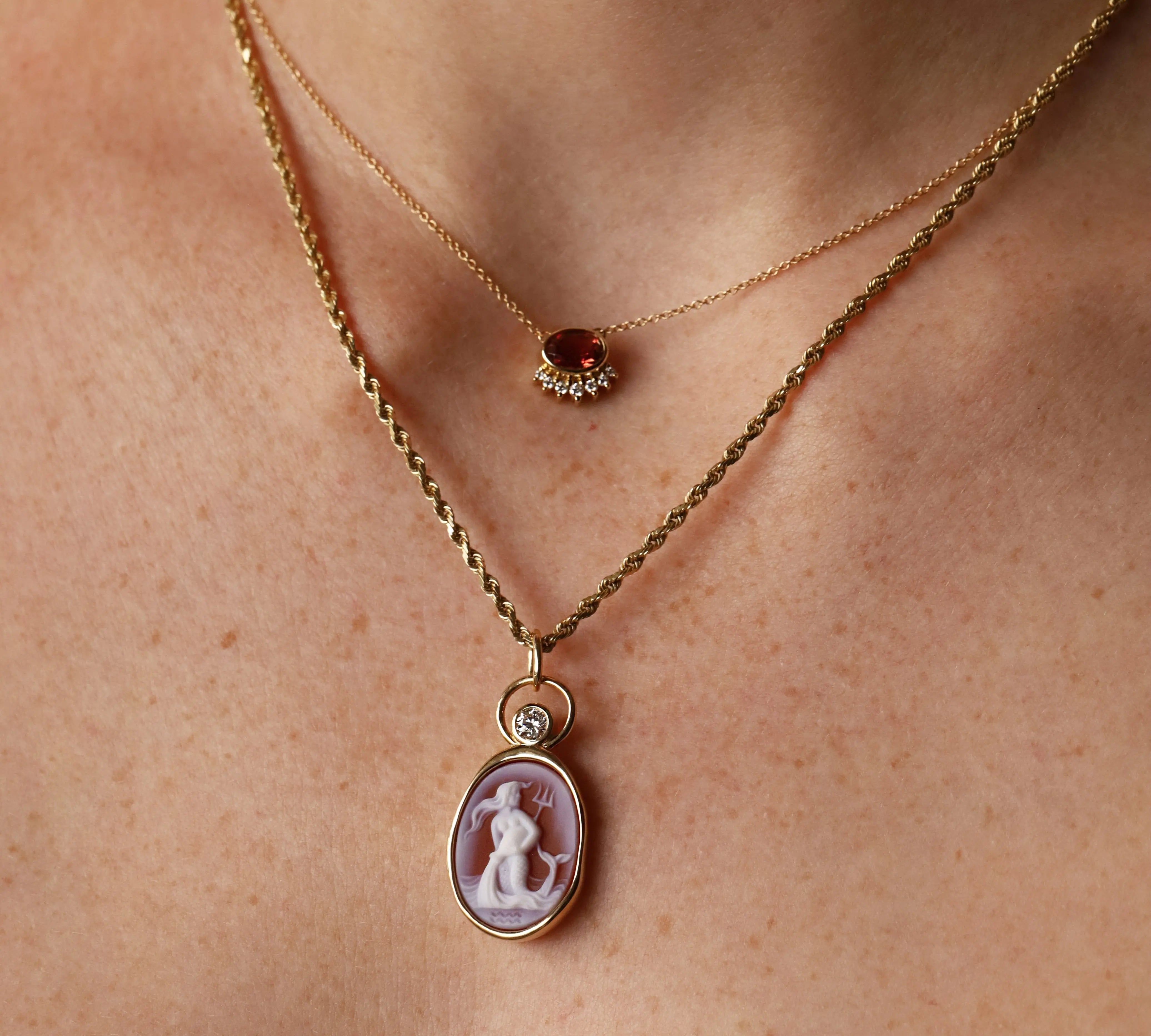 Aquarius Zodiac Orange Agate Carving with Diamond pendant, a hand-carved orange agate in 14k yellow gold with a round diamond, by Marrow Fine