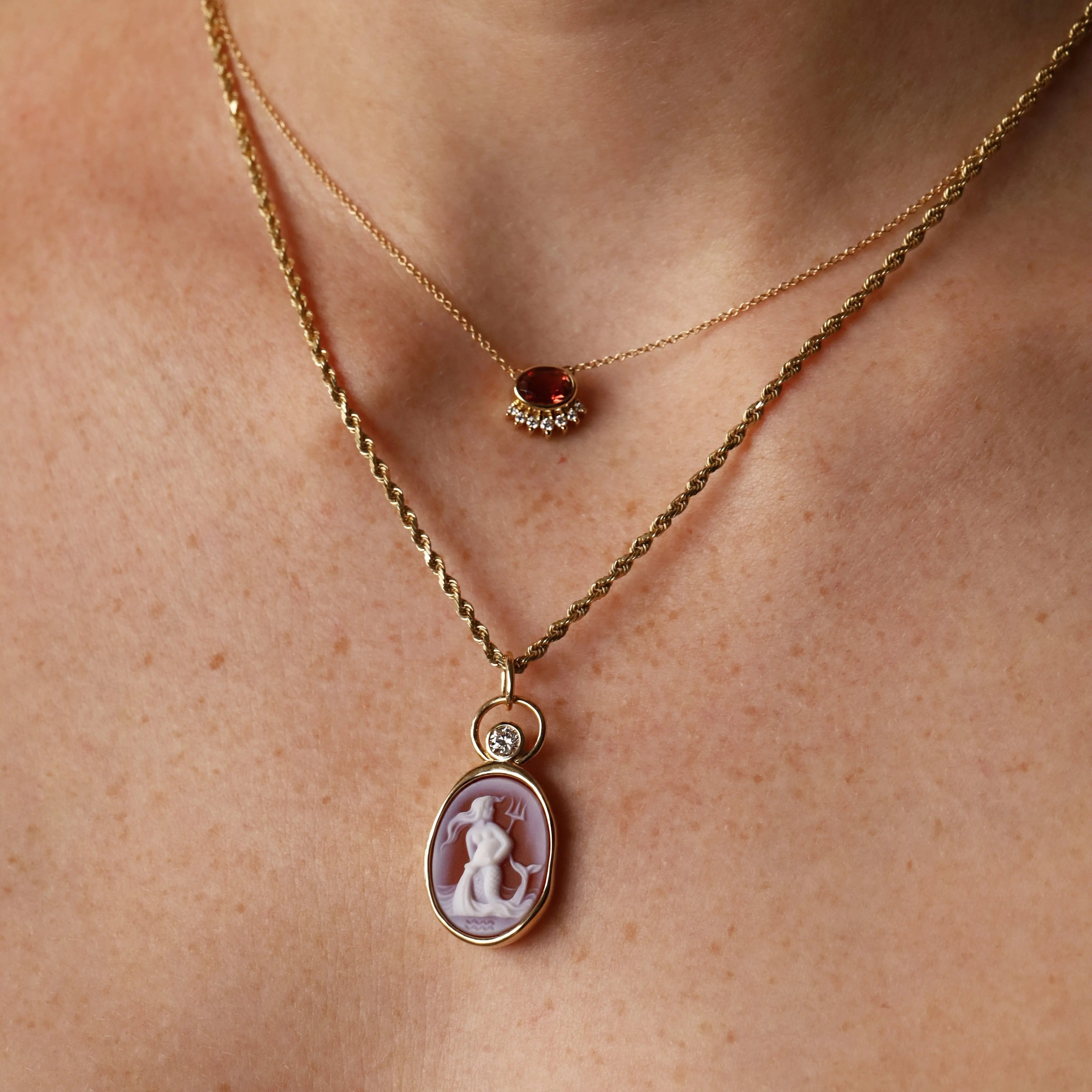 Aquarius Zodiac Orange Agate Carving with Diamond pendant, a hand-carved orange agate in 14k yellow gold with a round diamond, by Marrow Fine