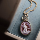 Aquarius Zodiac orange agate carving pendant in 14k yellow gold with a floating diamond