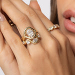 Close up of model with hand resting on her face, featuring Arno Serpentine Band