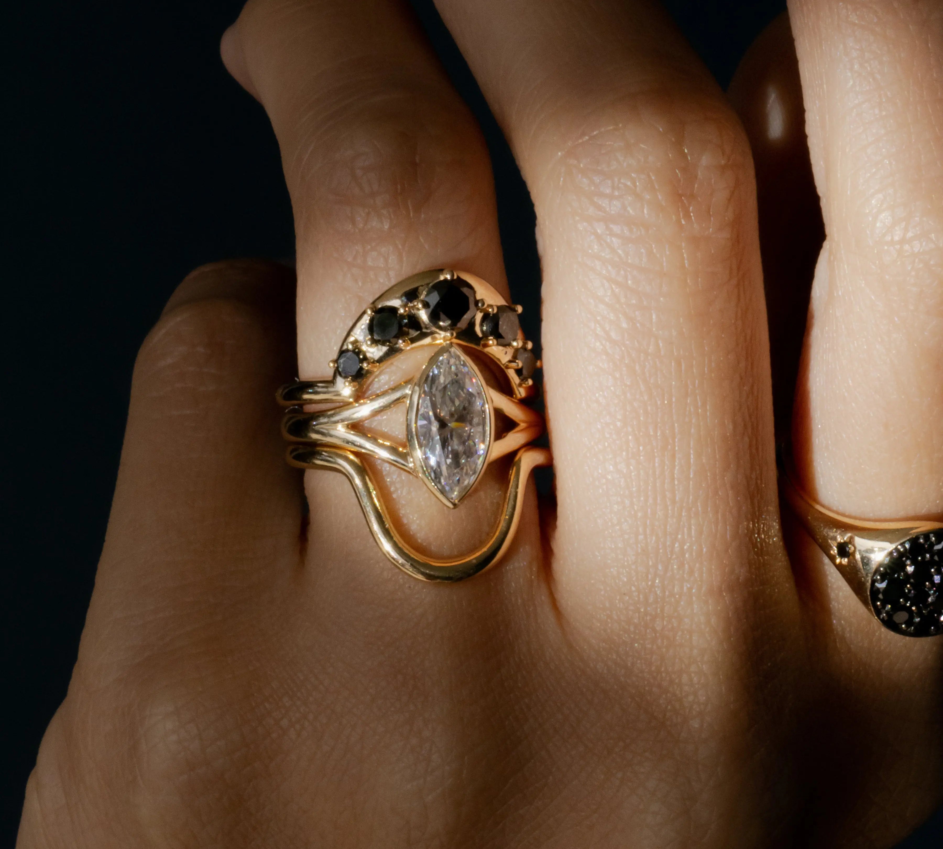 Black Diamond Crescendo Stacking Band on hand close up, styled with other Marrow Fine rings