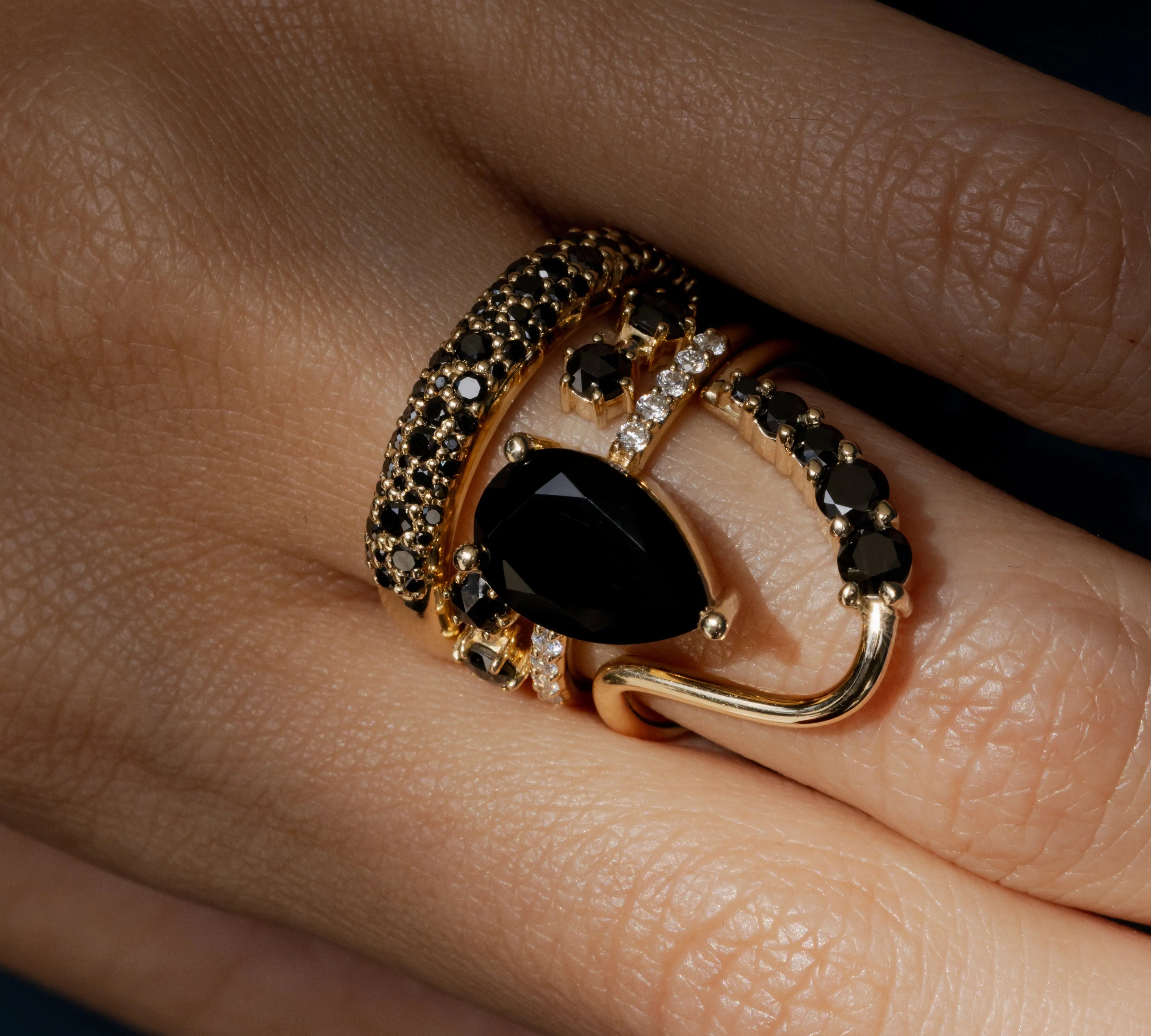 Black Diamond Lucy Wave Band close up on hand, styled with other Marrow Fine rings