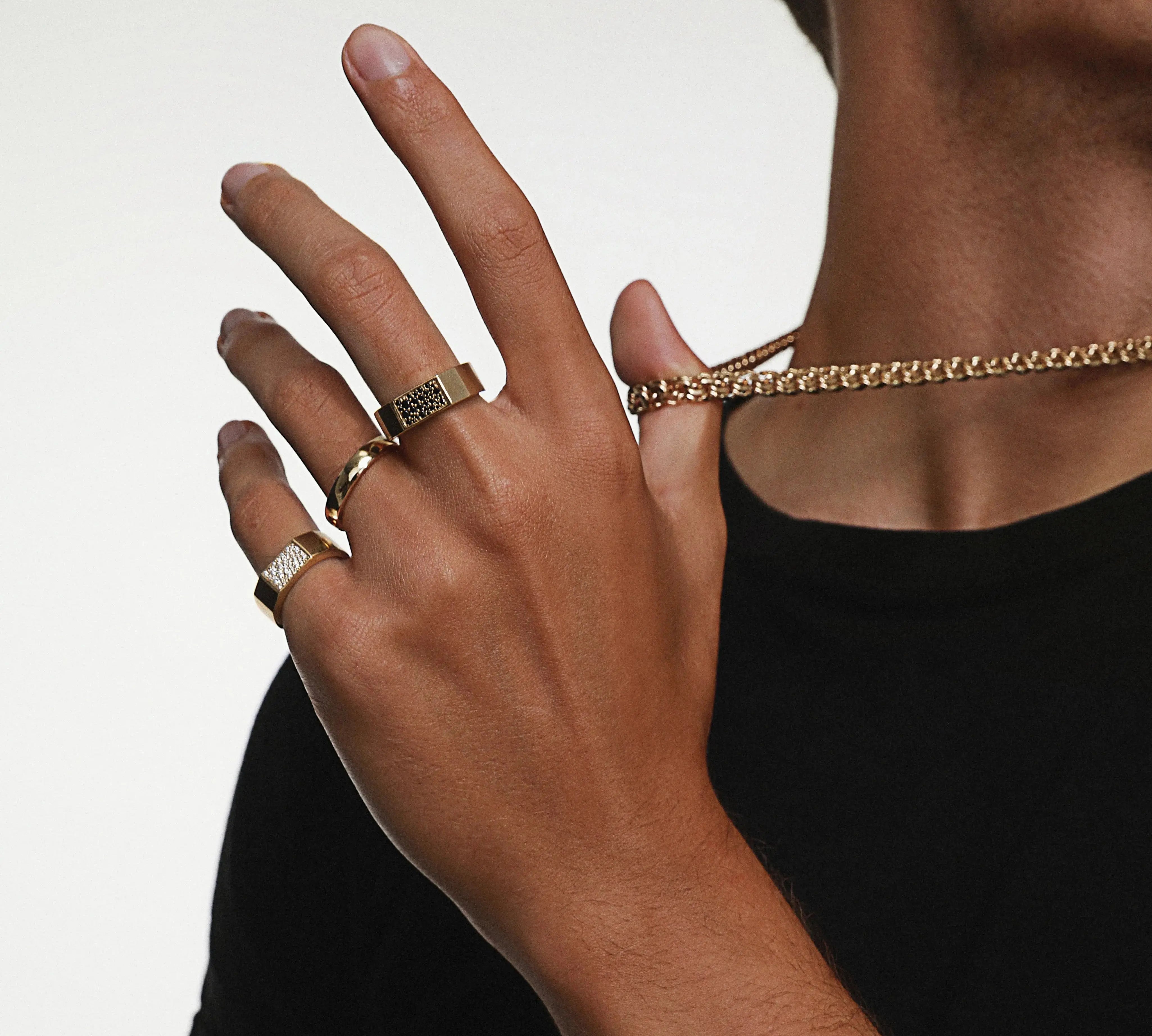 Close up of man wearing White Diamond Colson Band and Black Diamond Colson Band