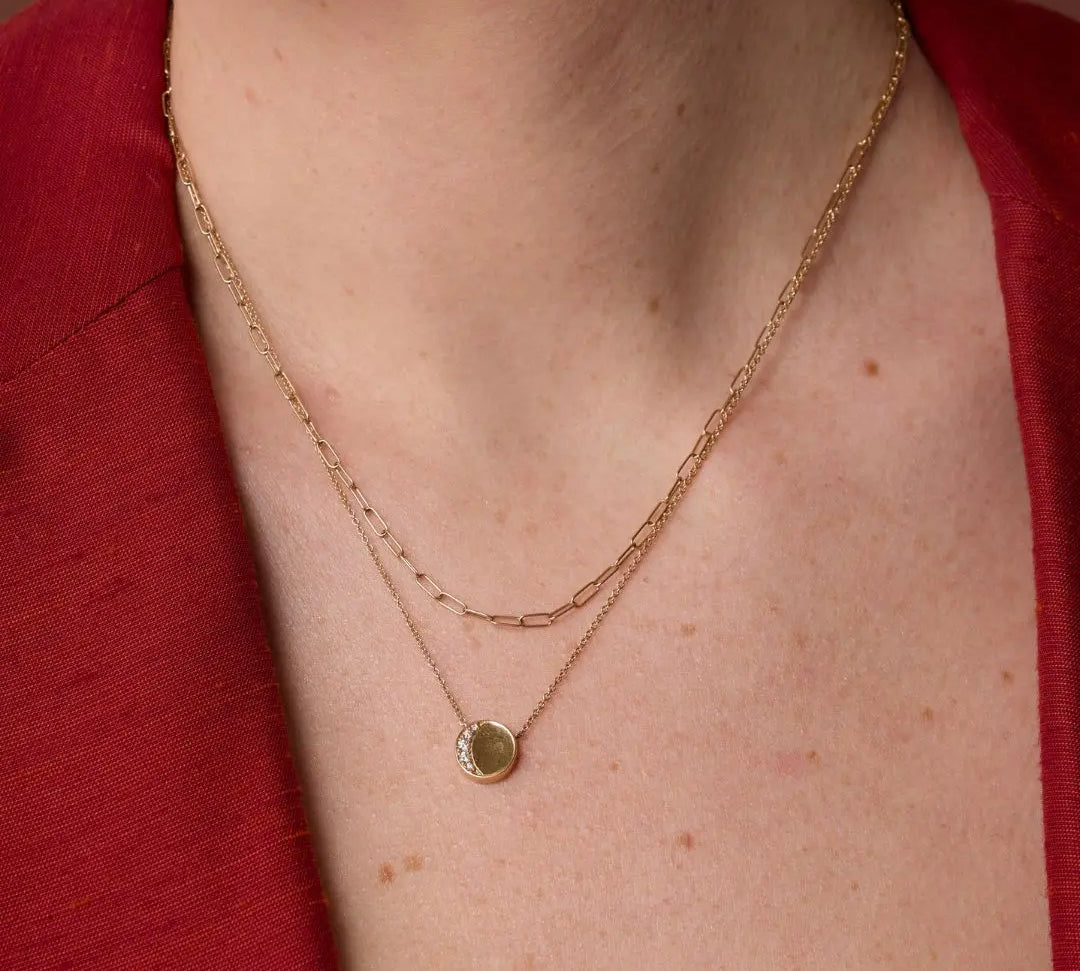 Close up of Under the Perfect Moon Pendant - Crescent Moon on woman's neckline