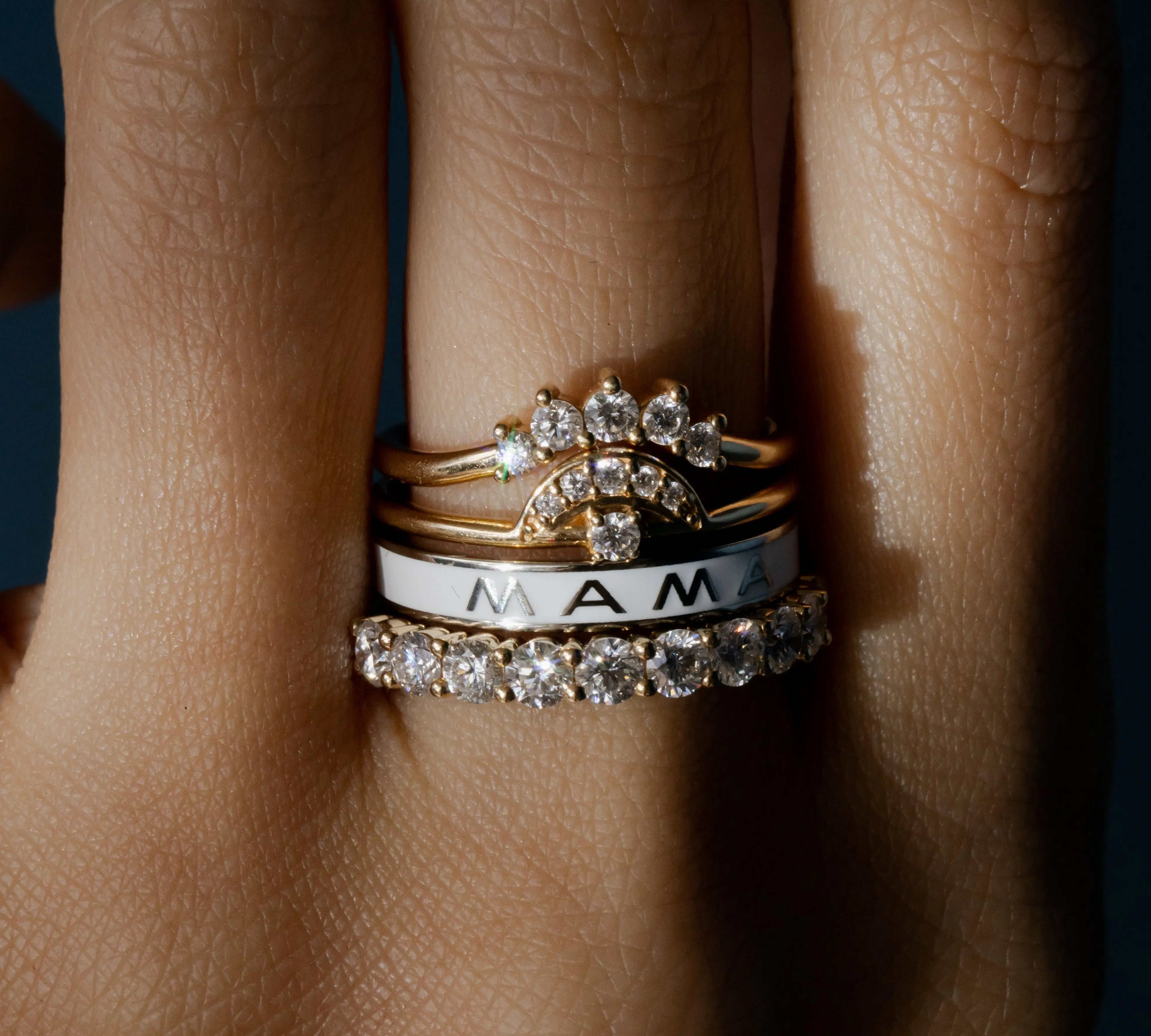 Close up of White Diamond Crown Ring stacked on hand
