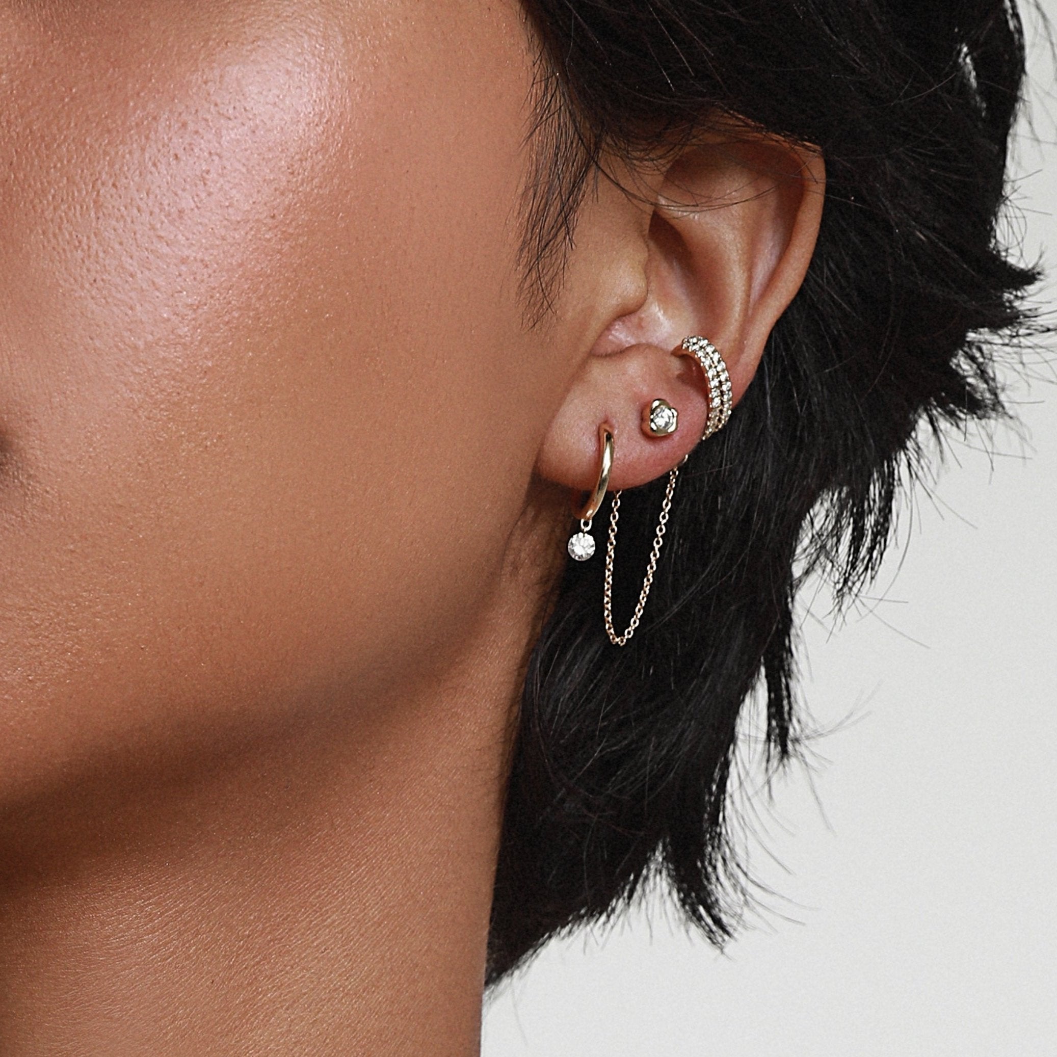 Close up of woman wearing Marrow Fine Diamond Drop Hoops 