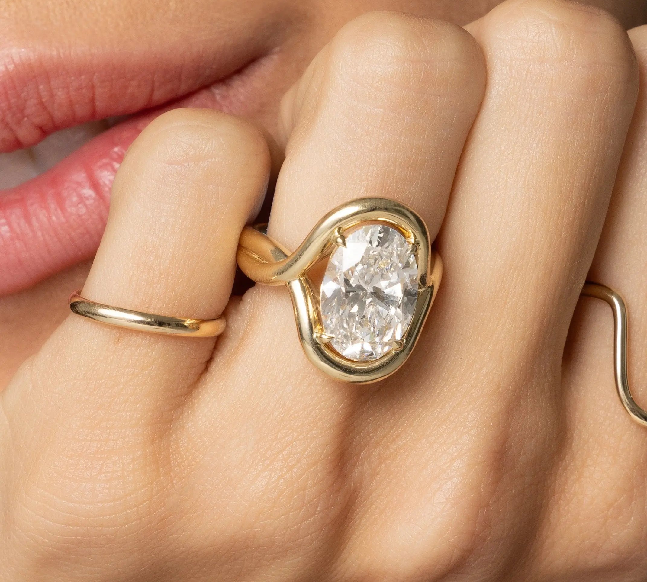 Close up of woman resting hand against her chin featuring the Marrow x Sammi Florence Ring
