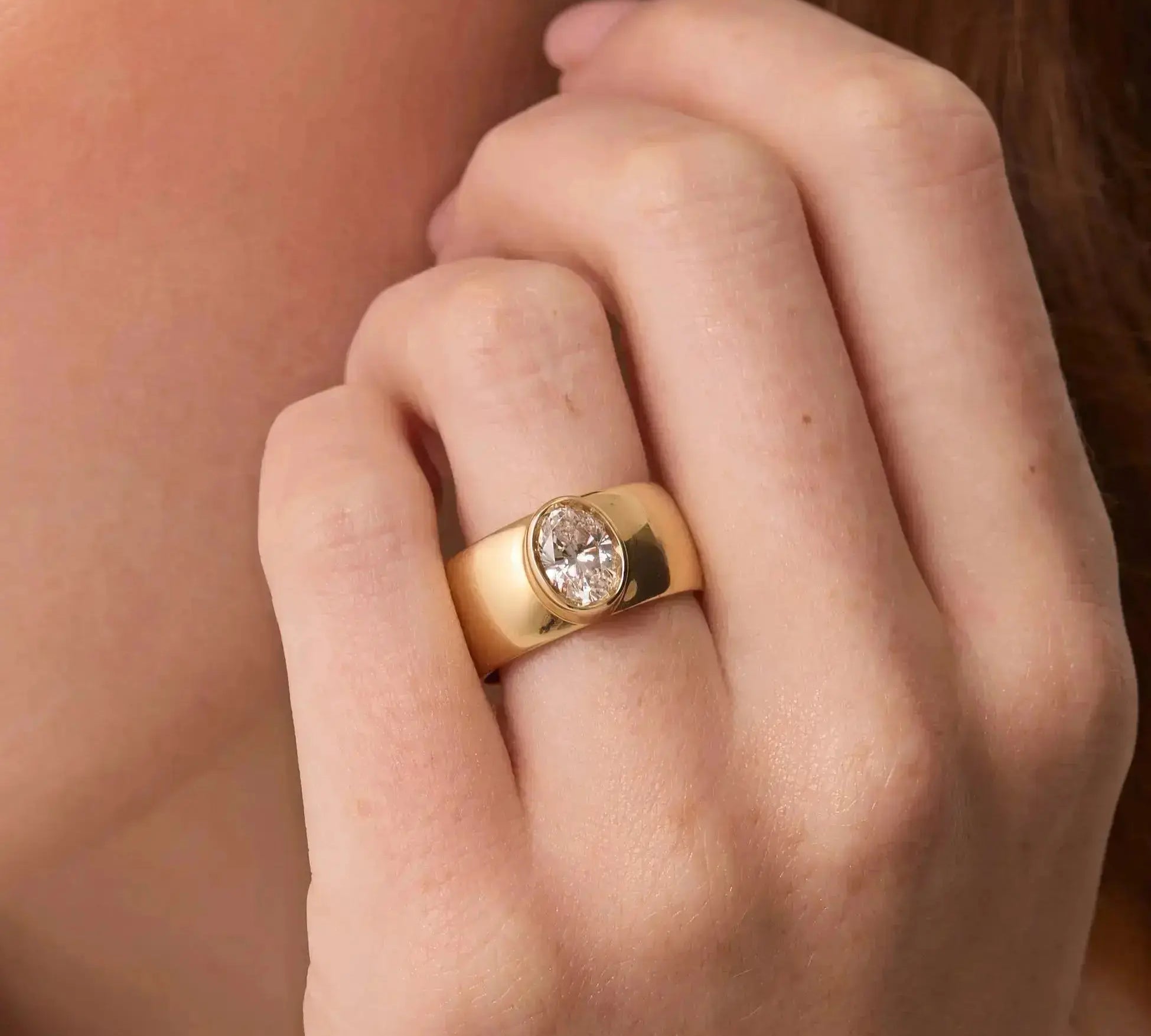 The Harlow Cigar Band Engagement Ring close up on hand