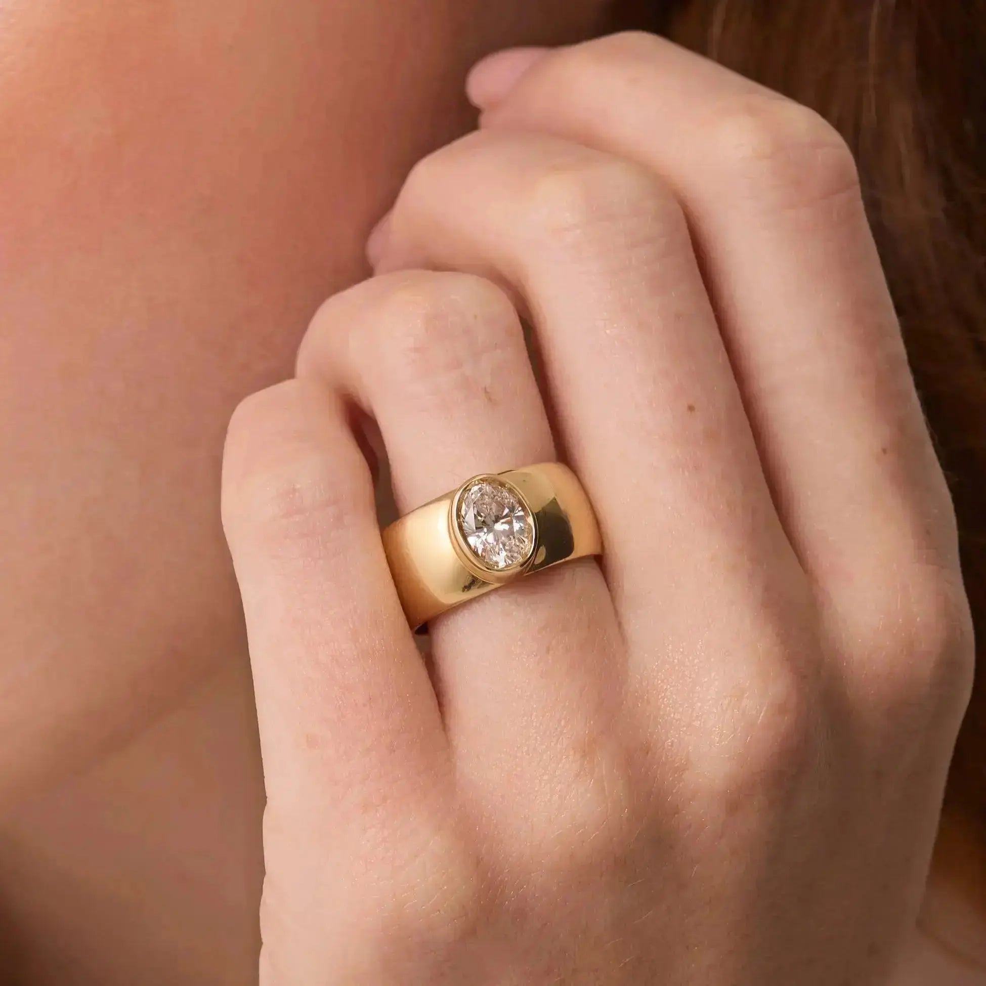 The Harlow Cigar Band Engagement Ring close up on hand