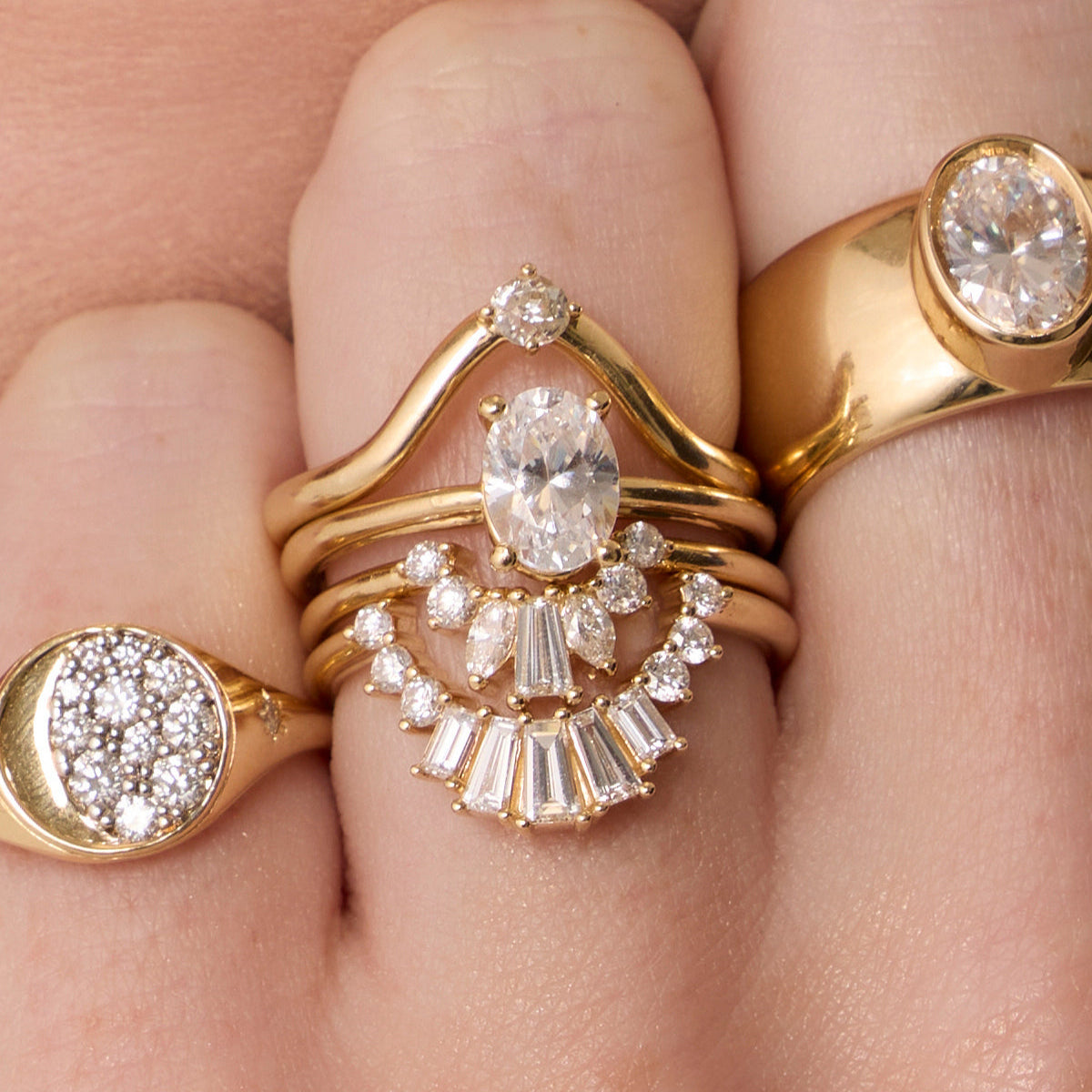 The Helene Oval Solitaire Engagement Ring close up on hand