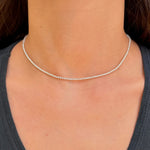 Diamond tennis necklace on neck
