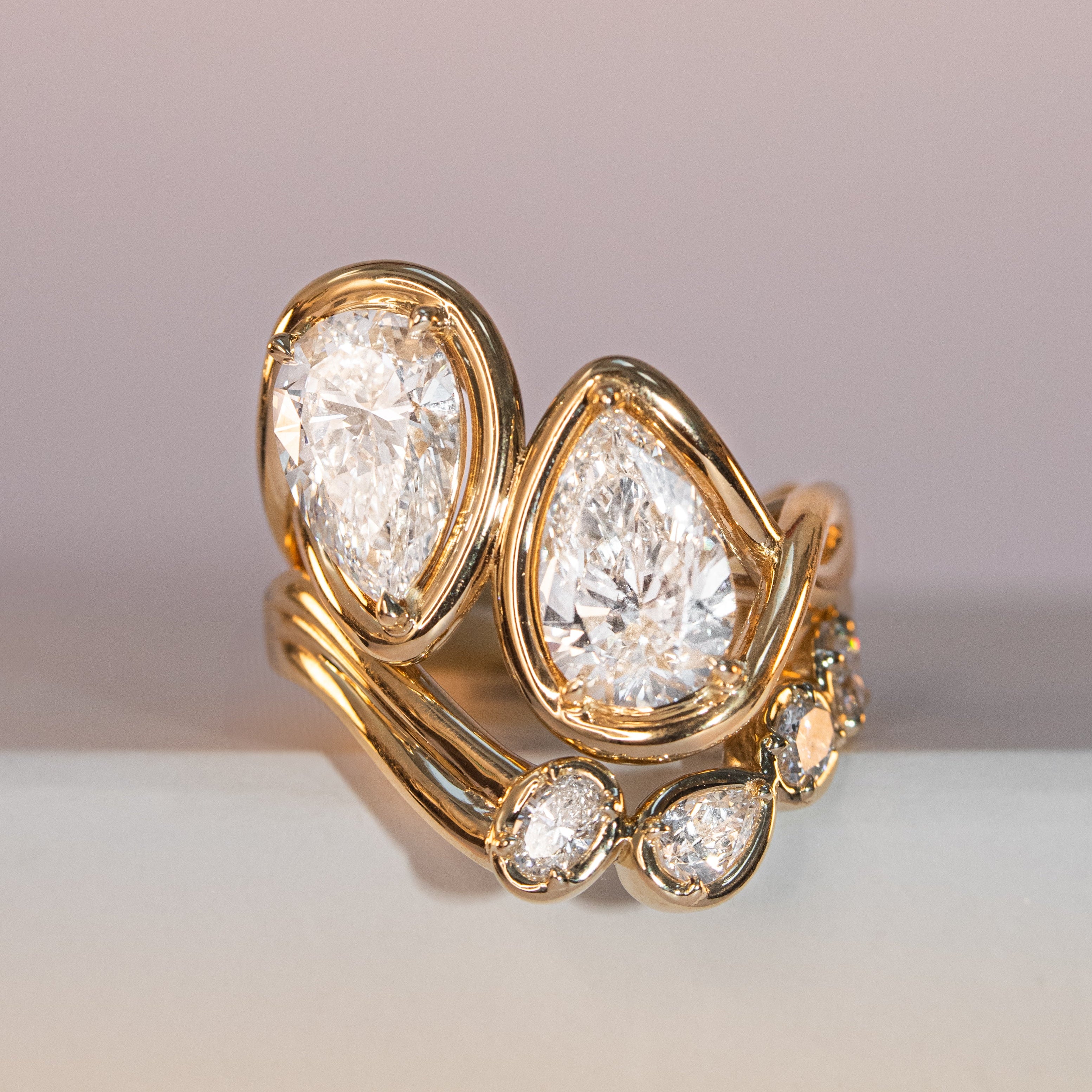 Joanie Bypass Ring + Simone Arch Band flat lay