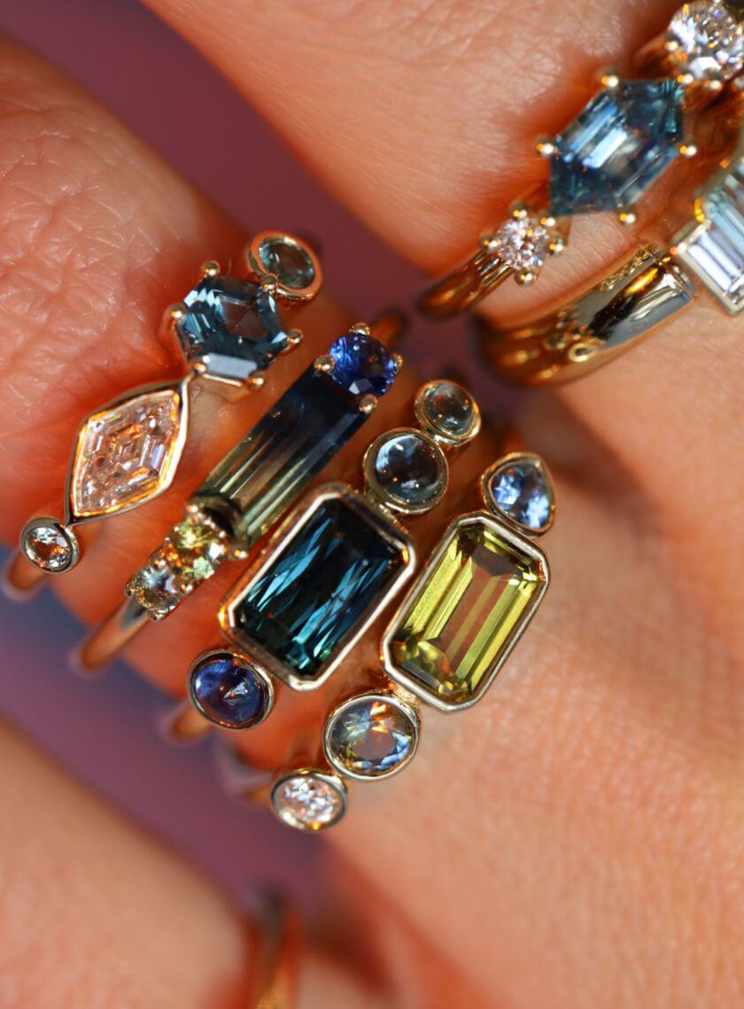 close up of fingers with multiple rings stacked from the Kaleidoscope collection