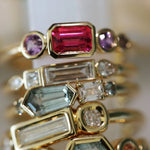 Stack of rings with colorful gemstones, close up