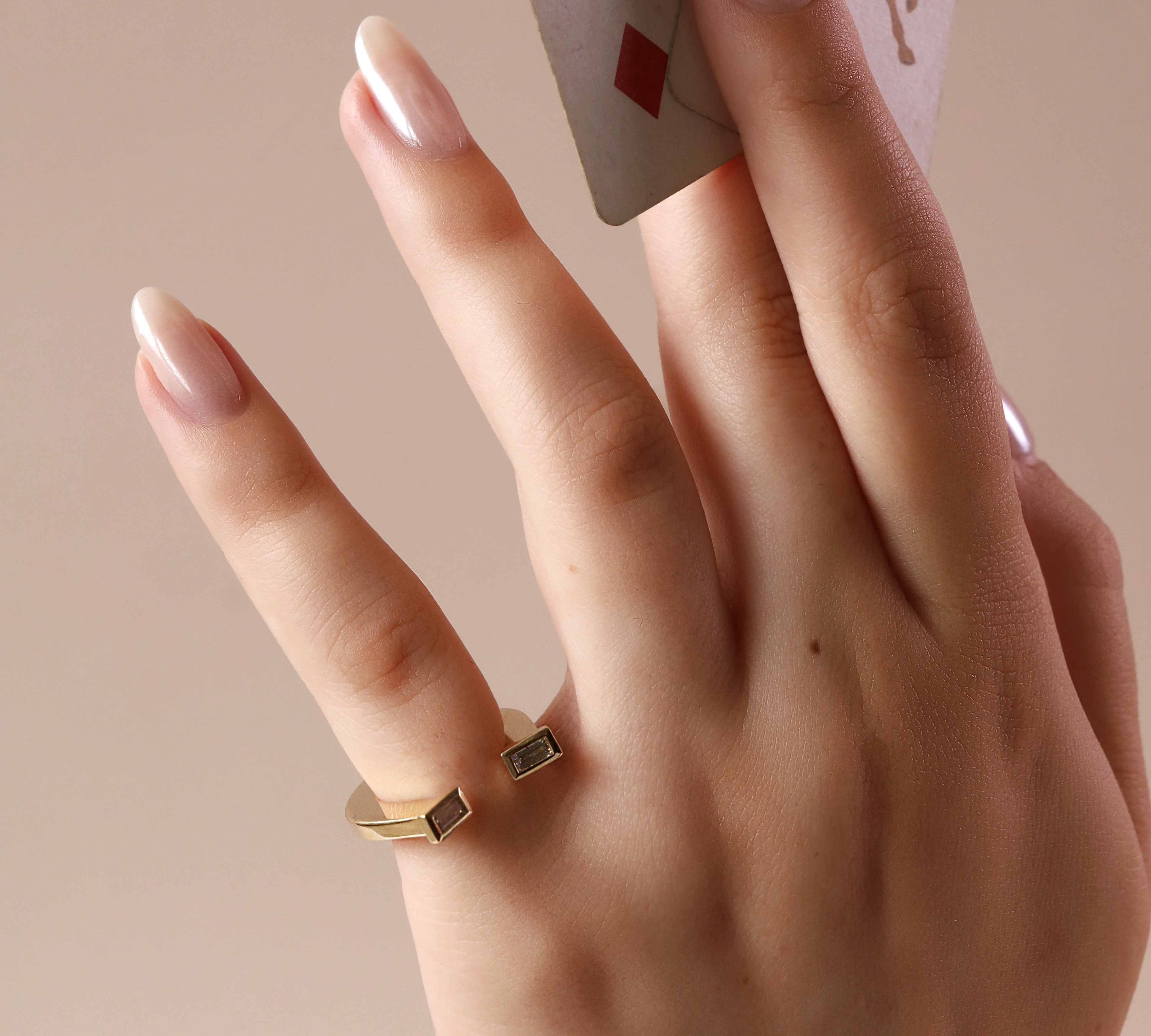 close-up of horseshoe ring on pinky