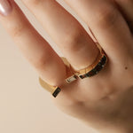 close-up of pinky horseshoe ring