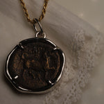 Larissa and Horse Bronze Coin Pendant worn on a chain, horse side facing out
