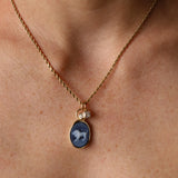 Leo Zodiac Black Agate Carving with Diamonds pendant worn on the neck, a carved black agate lion in 14k yellow gold