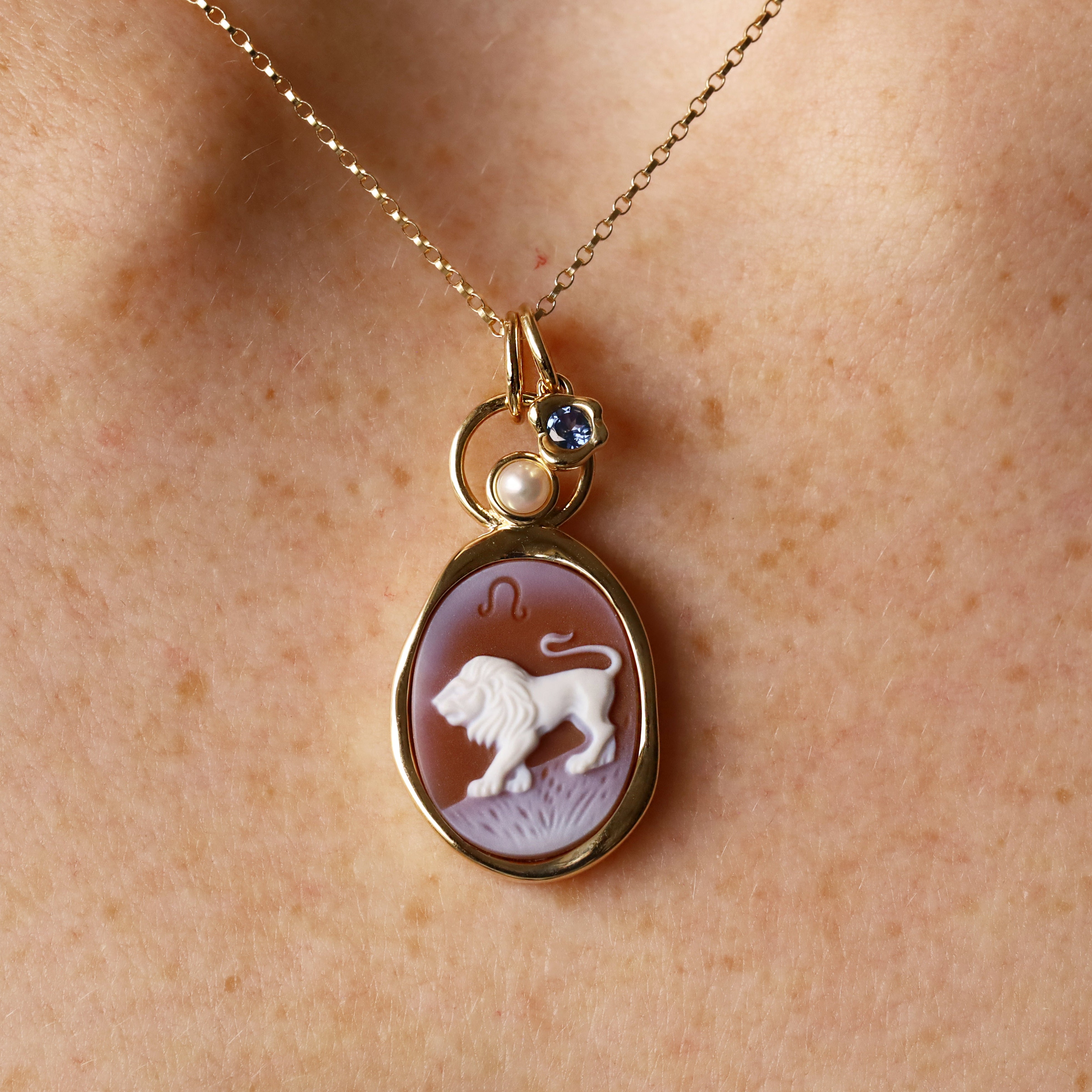 Leo Zodiac Orange Agate Carving with Pearl – white lion and Leo glyph carved on orange agate, set in 14k yellow gold