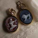 Libra and Leo Zodiac orange agate carving pendants with pearls, shown together