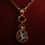 Libra Zodiac orange agate carving pendant in 14k yellow gold with a floating white pearl