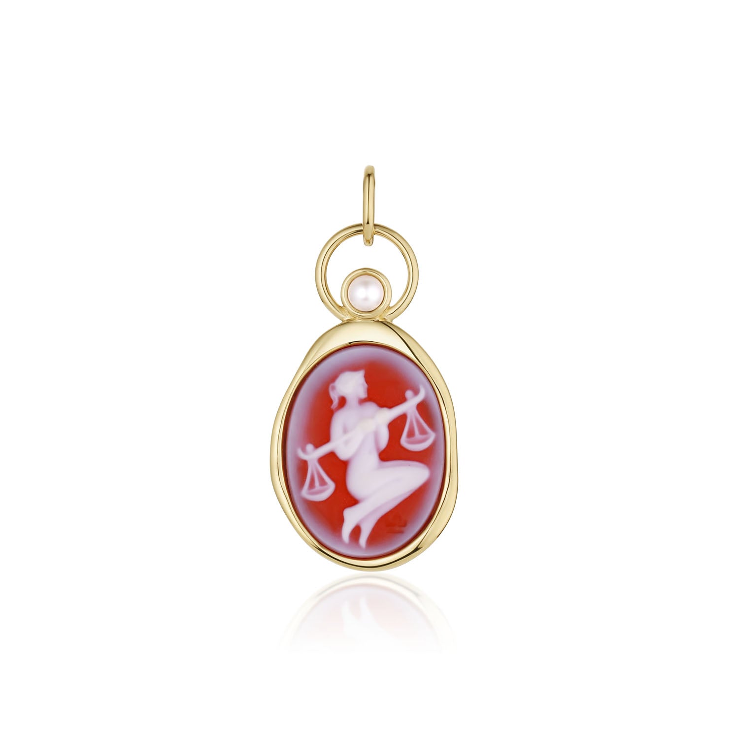Libra Zodiac Orange Agate Carving with Pearl – white figure holding scales carved on orange agate, set in 14k yellow gold with a white pearl in an open gold ring, by Marrow Fine