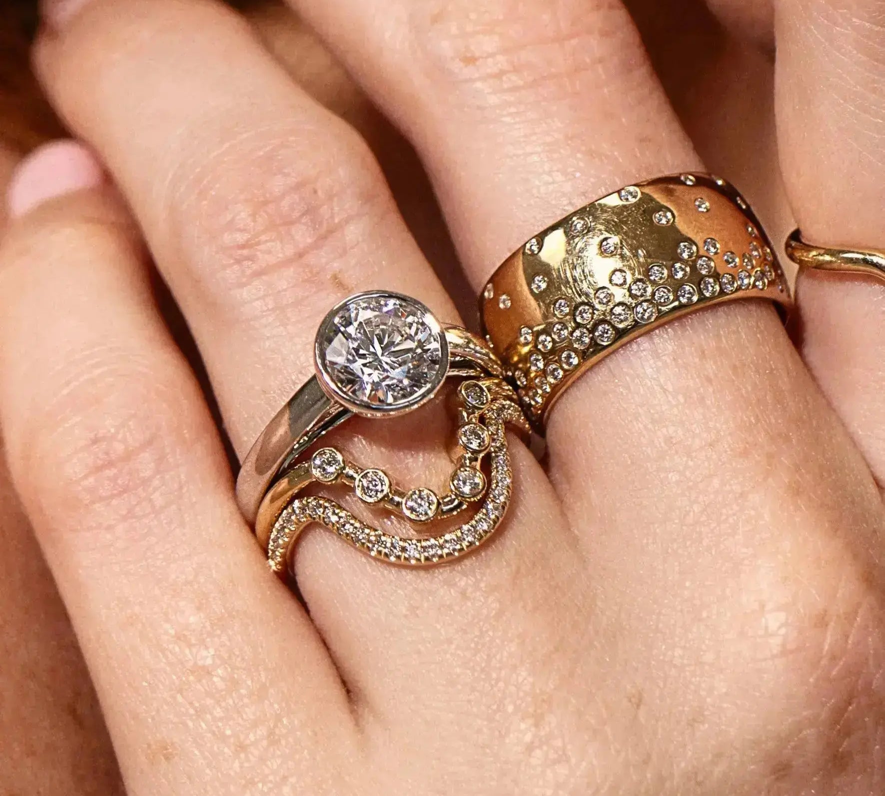 The Sloane Pear Solitaire Engagement Ring, close up on hand