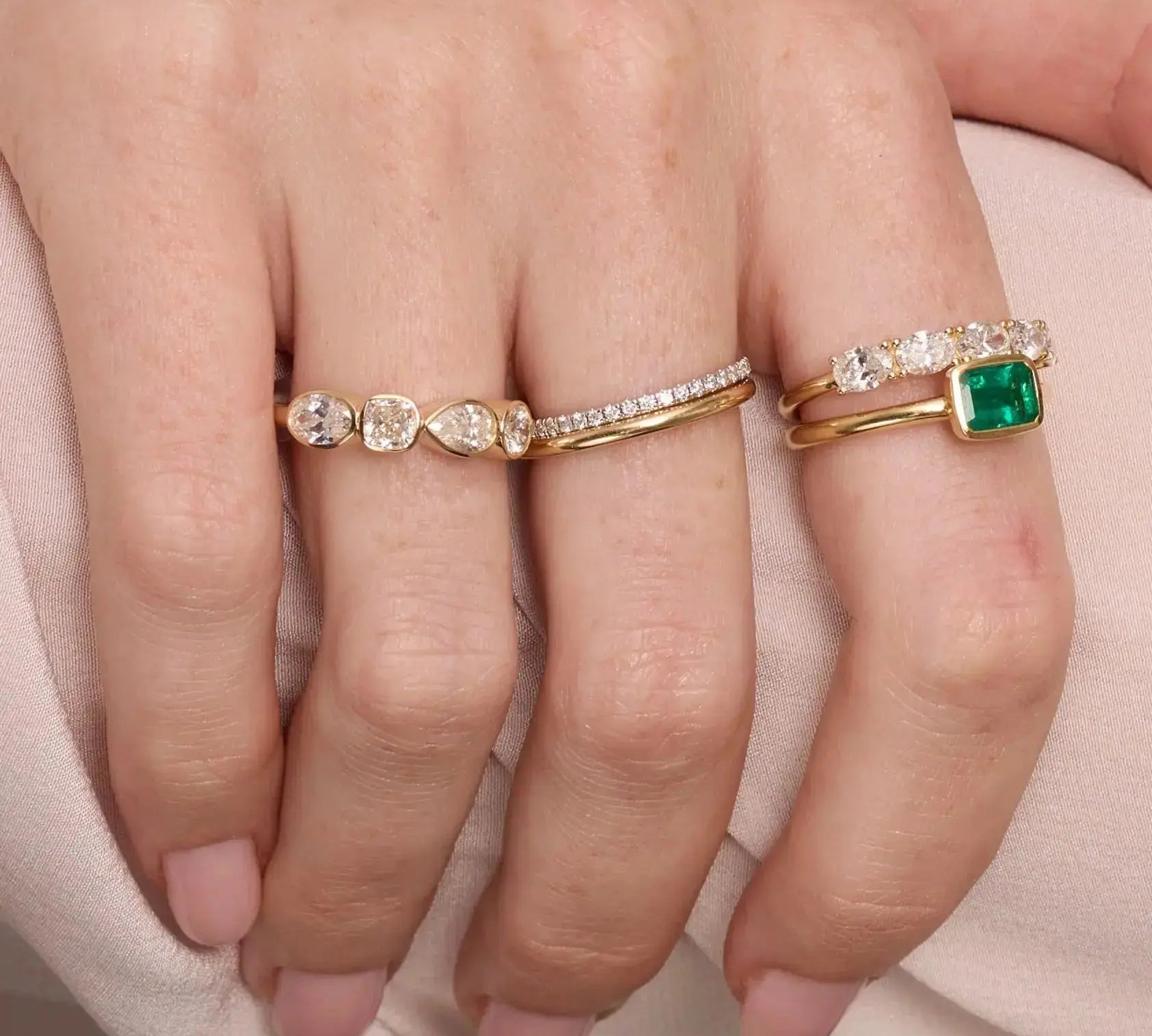 Close up of woman resting hands against chin with the Marrow Fine White Diamond Mixed Shape Bezel Band
