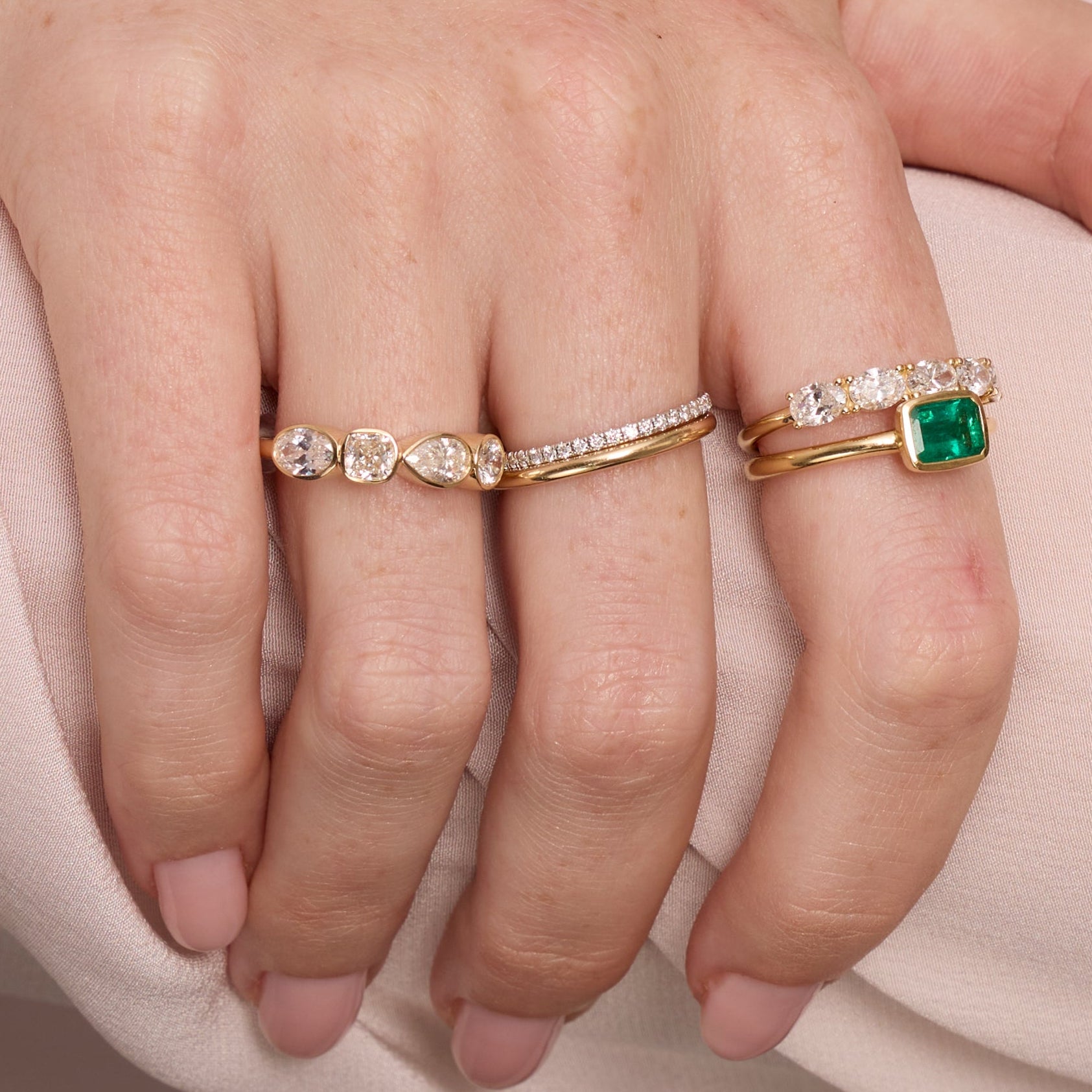 Close up of woman resting hands against chin with the Marrow Fine White Diamond Mixed Shape Bezel Band