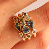 Close up of 1.08tcw Montana Sapphire Linear Ring + 0.52ct Montana Sapphire, Sapphire and Diamond Kaleidoscope Ring + 0.62ctw Montana Sapphire Linear Ring on woman's hand