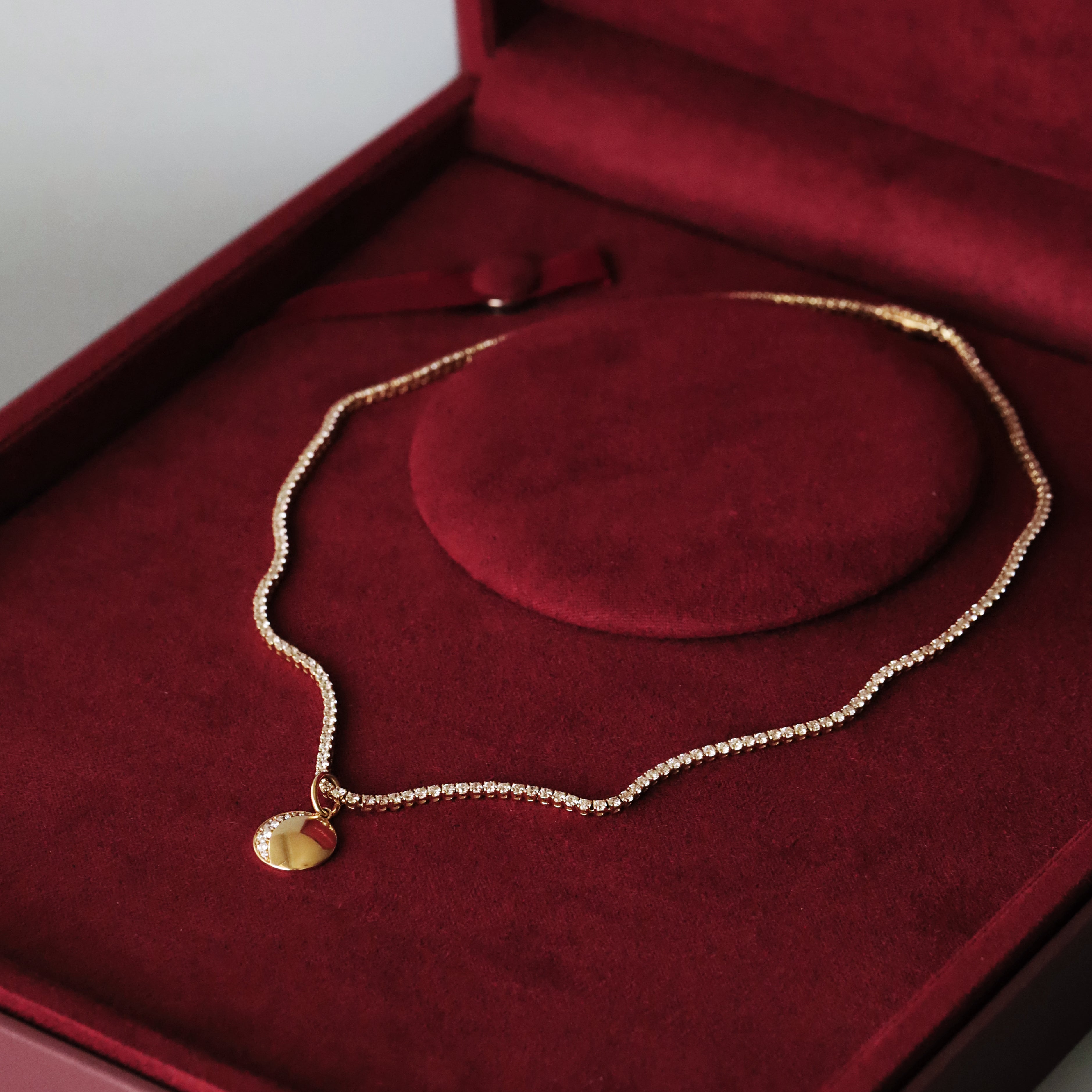 Moon phase charm necklace with a Marrow Fine gift box