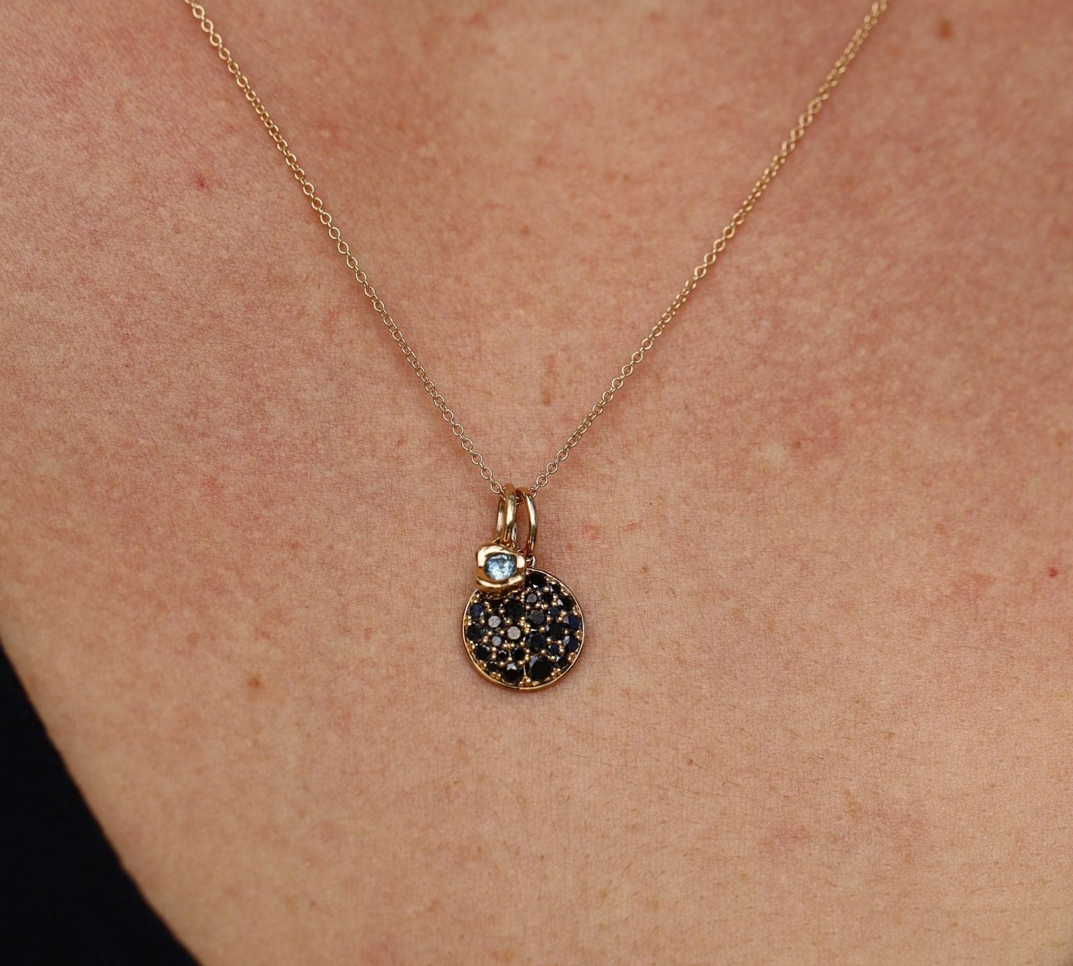 Necklace with a pendant worn on a person's neck