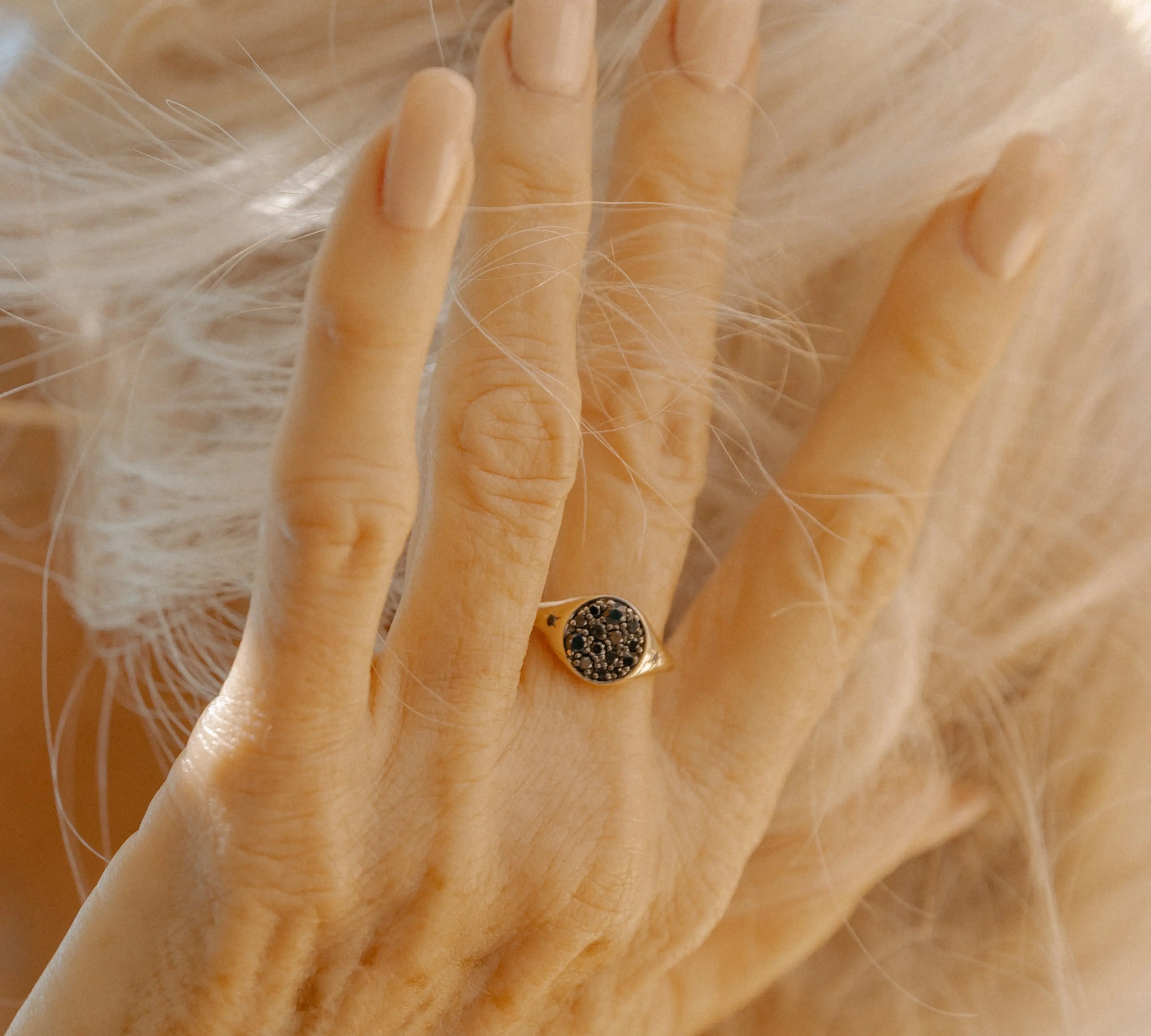 Close up of New Moon Signet Ring on hand