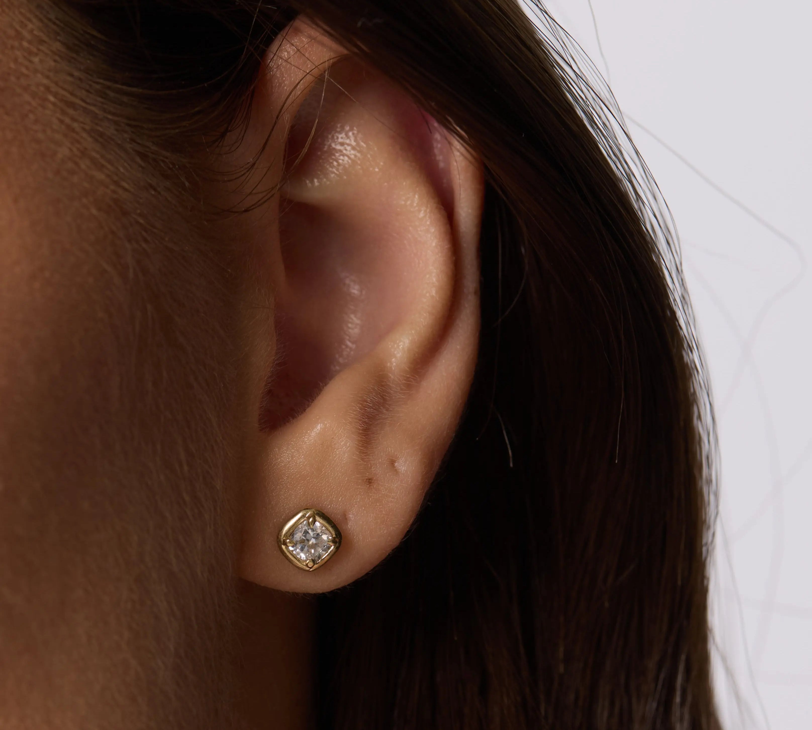 Close up of woman ear spotlighting Nina Cushion Studs